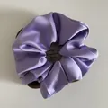 Detailed view of lilac satin scrunchie with French style elegant glossy silk texture - Large / Purple