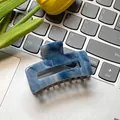Blue marble square hair claw clip for French style updo shown on a dark laptop - Blue 6cm