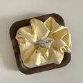 French minimalist satin silk scrunchie in cream yellow with soft pleated texture - Medium / Yellow