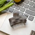 Minimalist smoky grey marble square hair claw clip on a laptop with a tulip decoration - Gray