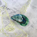 Detail of shell-shaped acetate hair claw with blue marble texture and gold accents - Marble Shell Shape (F)