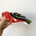 Vibrant parrot-shaped acetate hair claw clip with colorful wings for creative hair styling - Red Parrot