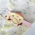 Detailed close-up of parrot-shaped hair claw clip made of pearlescent acetate material - 14.5*7.5cm / Yellow