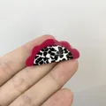 Magenta and cow pattern acetate hair clip with wavy edges held by hand - Dragon Fruit Style