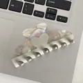Pearlescent white acetate hair claw clip with heart relief detail on a laptop background - Marble Gray Heart