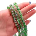 Faceted green glass spacer beads with rose flower pattern and gold glitter for DIY jewelry - Green