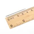 Single 4.5cm large-eye steel sewing needle shown against a ruler for size reference - 0.8*44mm