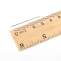Single 40mm stainless steel sewing needle with large eye on a wooden ruler - 0.6*36mm