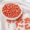 Mix of coral pink pearlescent ABS beads with holes for DIY jewelry and crafts - Deep Orange Red