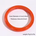 Detail view of orange resin bangle showing 6.1cm inner diameter and 0.8cm thickness - Round Style (17#)
