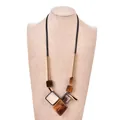 Ethnic acrylic pendant necklace with amber and ivory geometric blocks on a brown wax cord - Tortoiseshell Brown