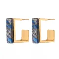 Modern C-shaped gold metal earrings with deep blue marbled inlay on white background - Blue Plaid