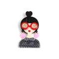 Acrylic girl brooch with red glitter glasses and pink heart earrings on grey top - Bun Hairstyle With Pink Earrings / Black and White Polka Dot