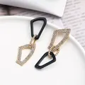 Boucles d'oreilles pendantes géométriques noir et or avec strass brillants pour femme - Style Trapèze Géométrique Noir (EH00157)