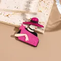 Acrylic vintage style brooch featuring a pink hat lady silhouette on stone props - Magenta