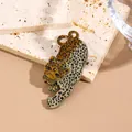 Leopard shaped acrylic brooch with leopard print enamel finish on a golden metal base - Medium Coffee Water Pattern