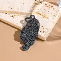 Deep grey acetate cheetah brooch with black spots on a natural travertine stone base - Black Gray Water Pattern