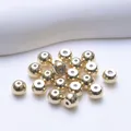 Macro view of polished 18K gold-plated 5mm round ball beads for DIY jewelry making - Round Ball Style (Q152) / 14K Gold Plated