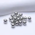 Detailed view of 5mm 18K gold plated silver sphere earring backs with silicone core - Round Ball Style (Q152) / Platinum Plated
