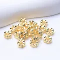 Detail shot of 18K gold plated flower spacer beads with intricate spiral engravings - Outer Diameter 6mm / 18K Gold Plated