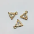 Close-up of golden triangle alloy pendants with inlaid zircon and radial texture - Triangle Shape / Gold