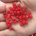 Red star silicone earring backs held in hand to show size for DIY jewelry making - Red Star Style