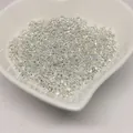 Macro view of silver loose spacer beads in a heart-shaped bowl for jewelry making - 2.5mm (Approx 40pcs/g) / Thick Silver Plated