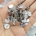 Close-up of S925 silver earring posts with flat base and side loops for DIY jewelry making - 6mm Flat Base / White Gold Plated (Color Retention)