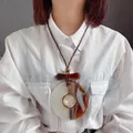 Collar étnico retro con gran colgante marrón y blanco en cordón trenzado - Colgante de Anillo Texturizado Café Blanco (XL00026)