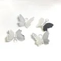Detailed macro view of four silver 3D butterfly pendants with mesh texture for DIY jewelry - Silver Color (H116)