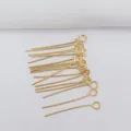 Macro shot of 14k gold-filled eye pins for DIY jewelry making and handmade beading crafts - 40mm x 0.7mm / 14K Gold Plated