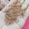 Close-up of rose gold screw clip-on earring converters for DIY handmade jewelry making - Flat Head Style (D36) / Rose Gold