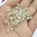 18k gold plated butterfly ear nuts with transparent silicone cushion caps in hand - Round Style (A89) / 18k Gold