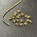 Close-up of 14K gold plated 1.2mm ball chain connectors for DIY jewelry making - Covered Button / 1.2mm