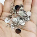 Macro shot of silver ear hooks with flat base pads held in palm for DIY jewelry making - Platinum Without Loop / 8mm
