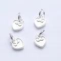 Set of four silver heart charms with intricate scroll engravings for DIY jewelry - Heart Style / Silver
