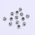 Macro detail of silver melon-shaped beads with vertical grooves for DIY jewelry making - 3mm / Platinum Plated