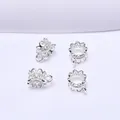 Macro view of four silver hollow flower petal spacers for DIY jewelry making and beading - 3-Way Style / Silver