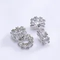 Detailed macro view of four silver 14k gold plated spacer beads with micro-pave cubic zirconia - Outer Diameter 4mm / Platinum Plated