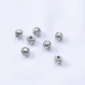 Macro view of 4.5mm silver hollow football beads with inlaid cubic zirconia for jewelry - White Gold-Plated Color-Preserving (H168)