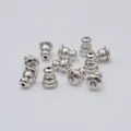 Macro shot of silver metal ear stud backings with silicone inserts for DIY jewelry - Bullet Style (M22) / Platinum