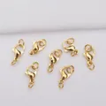 Detailed macro view of seven 24k gold vacuum plated lobster clasps for DIY jewelry making - Small Lobster Clasp With Ring (R22)