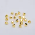 Macro shot of 14K gold-filled geometric faceted spacer beads for DIY jewelry making - 18K Gold Plated
