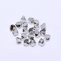 Detailed macro view of 17 irregular silver polyhedron metal beads for DIY jewelry making - Platinum Plated