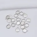 Macro shot of silver-plated round cabochon bezel settings for DIY jewelry making - Inner Diameter 8 / Single Loop White Gold Style (K29)