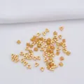 DIY jewelry material: 14k gold-plated triangular spacer beads on white fabric - Antique Gold