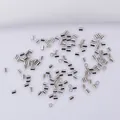 Polished silver crimp beads and jewelry tubes on white fabric for DIY necklace making - 2.0mm / Platinum Plated