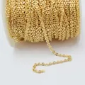 Macro view of 14k gold plated flat O-chain roll with diamond-cut texture for DIY jewelry - Fine Style / Gold