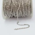 Bulk spool of silver flash O-chain for jewelry making with shimmering textured links - Fine Style / White Gold