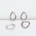 Macro detail of irregular hollow teardrop earring studs in polished 925 sterling silver - Hollow Irregular Style (L20 3#)